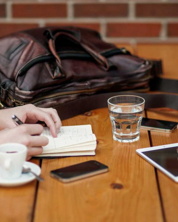 A business card with a QR code on a meeting table
