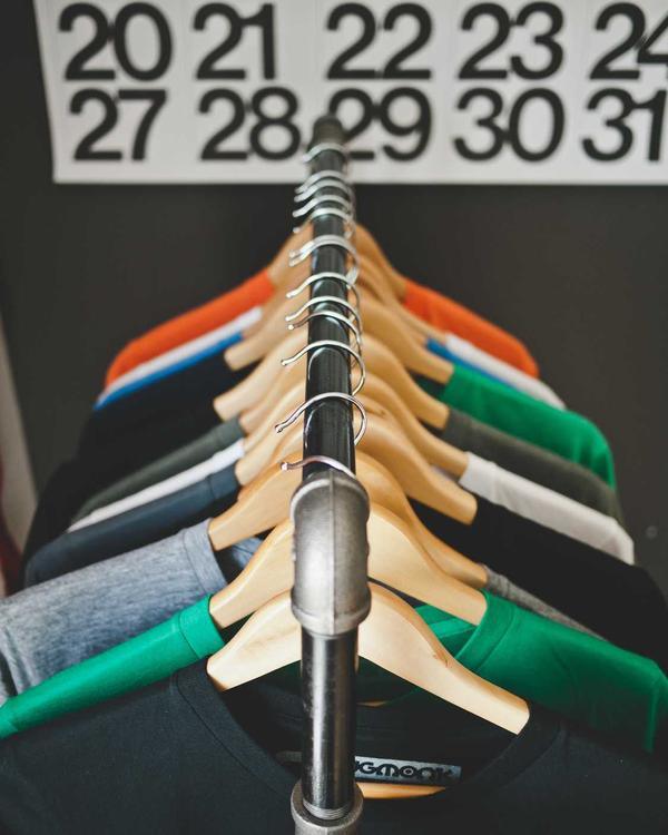 A merch hang tag with a QR code on a T-shirt